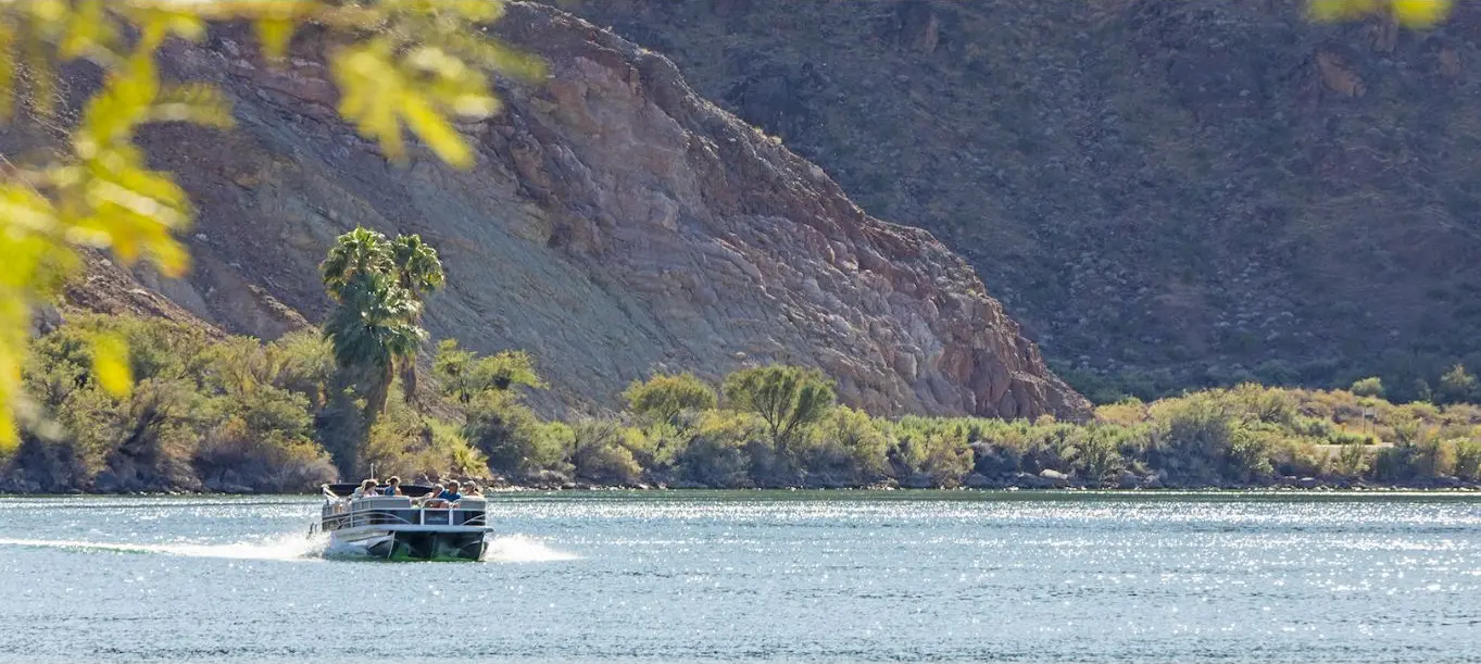Boat cruising the Colorado River at Buckskin Mountain State Park near Parker, Arizona