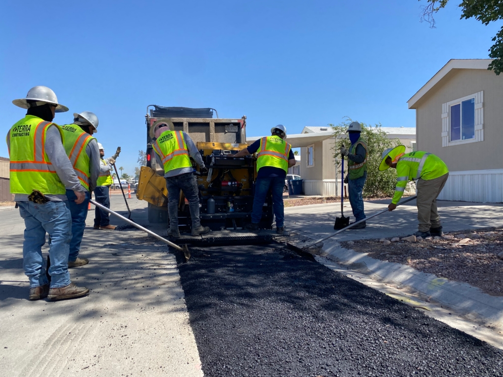 Terra Contracting crew completing an asphalt paving project