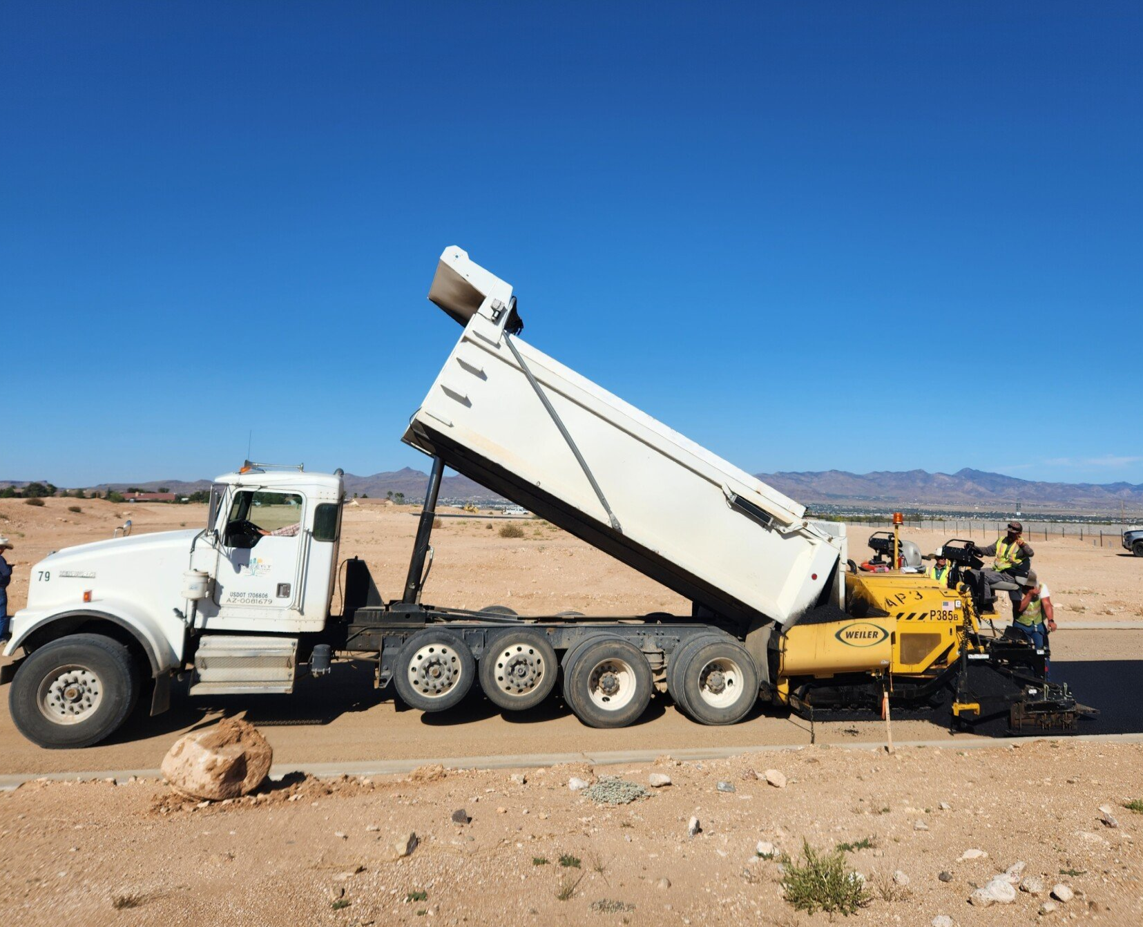 Desert Construction paving equipment and crew at work
