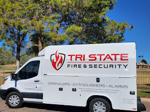 Tri-State Fire & Security Systems service van parked outdoors.